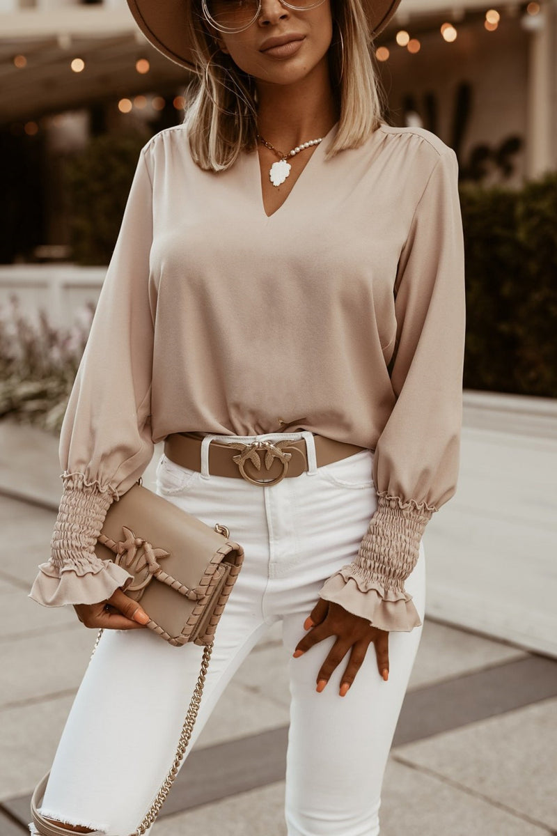 Wear a V-neck blouse for ladies